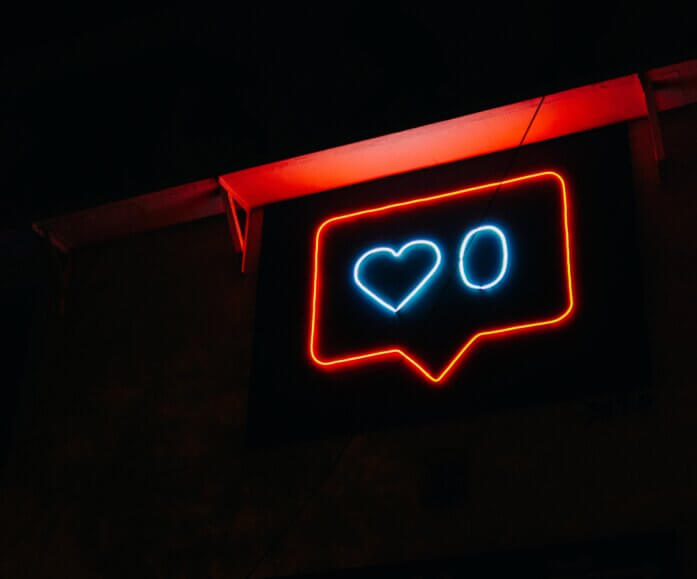 Social media likes icon in neon lights